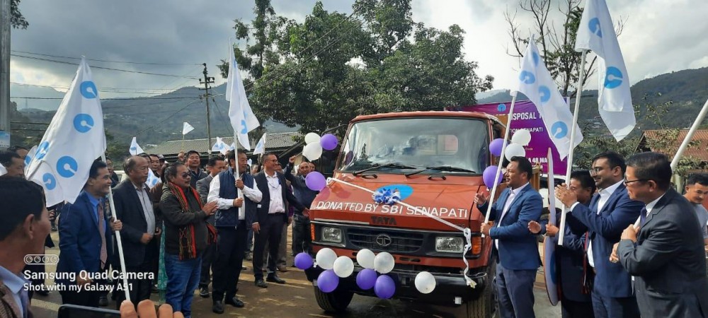 The waste disposal truck donated by the SBI Senapati to the District Solid Waste Management Committee being flagged off on November 30.